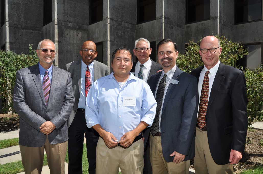  Stuart Butzier, Modrall Sperling shareholder, Alfred Mathewson, Co-Dean of the School of Law, Pablo Padilla, 2004 Sperling Scholarship recipient, Lynn Slade, Modrall Sperling shareholder, Sergio Perea, Co-Dean of the School of Law, and Walter Stern, Modrall Sperling shareholder and present.